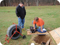 A septic drain field inspection using a sewer video camera.